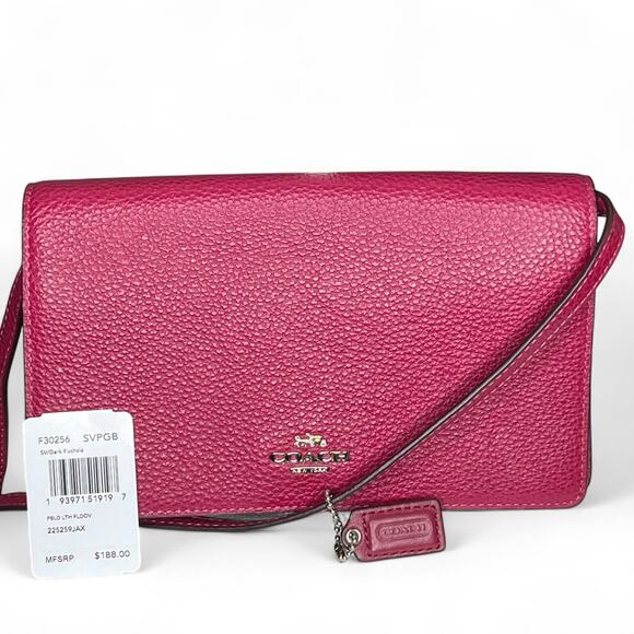 Coach Foldover Crossbody Clutch in the color Dark Fuchsia leather w/ charm NWT - Picture 1 of 13